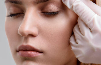 Woman getting forehead cosmetic dermal injection.